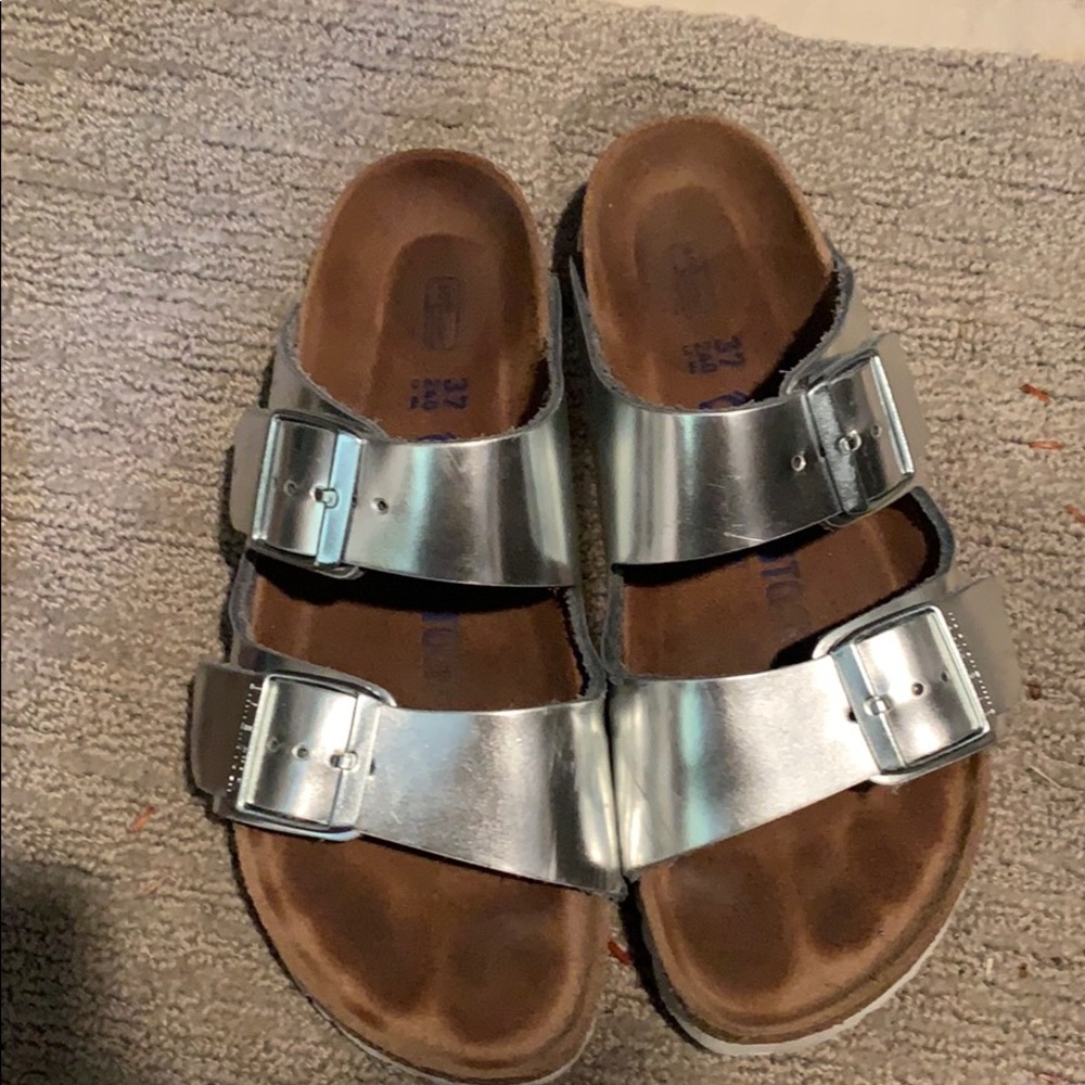 Silver and white Birkenstock’s